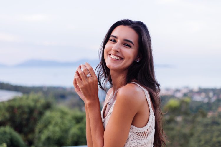 portrait-happy-caucasian-calm-romantic-woman-casual-look-with-long-hair-wearing-earings-necklace-background-amazing-beautiful-view-green-mountains